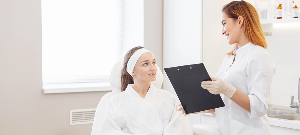 laser technicians consult with patient